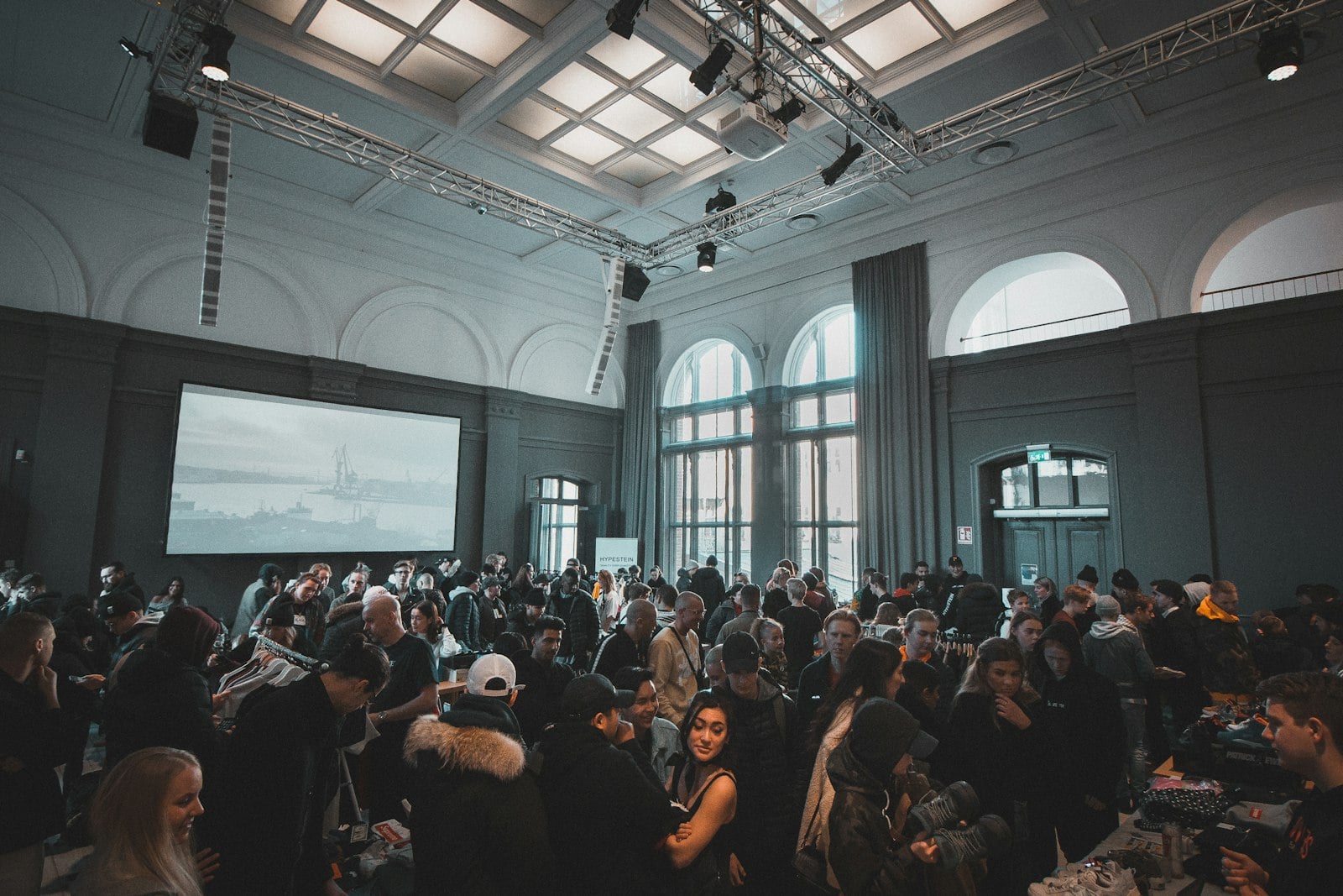Professional corporate event with guests and production details.