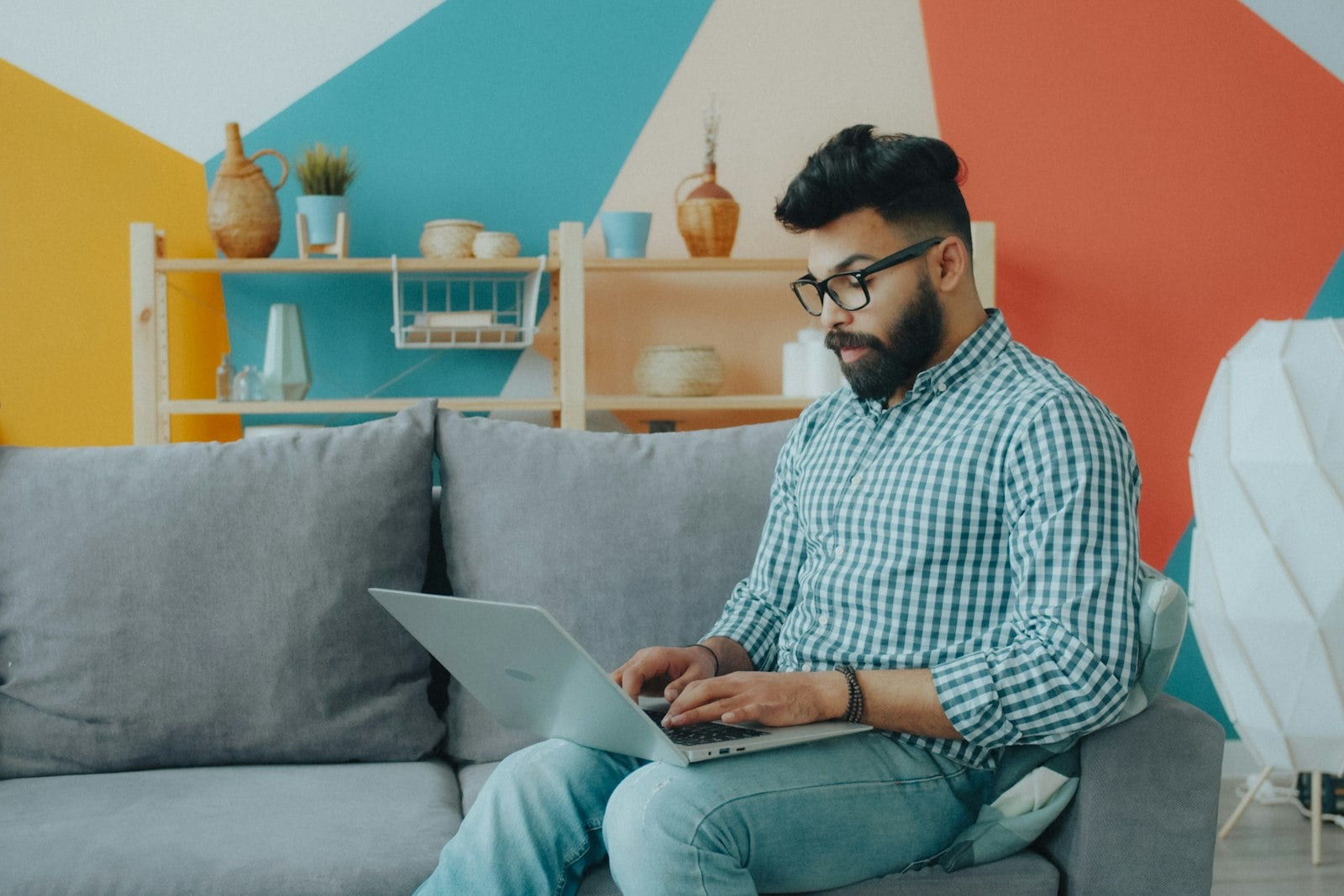 Professional working from a comfortable furnished apartment.