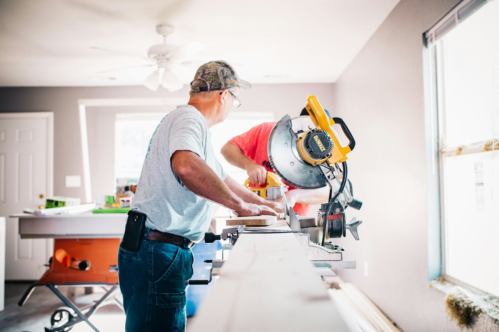Property owner reviewing renovation plans with a contractor.