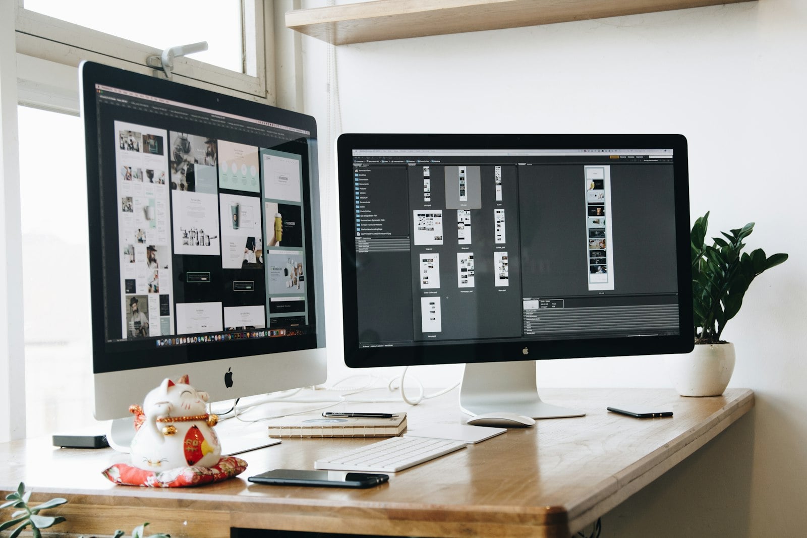 Designers and developers reviewing website layouts.