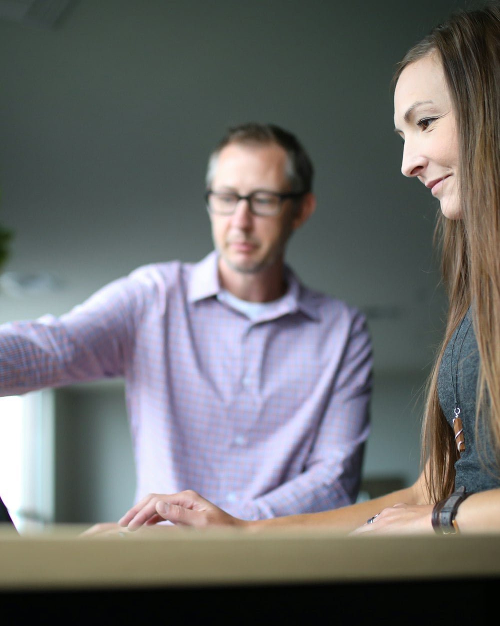 Two colleagues going over an update together
