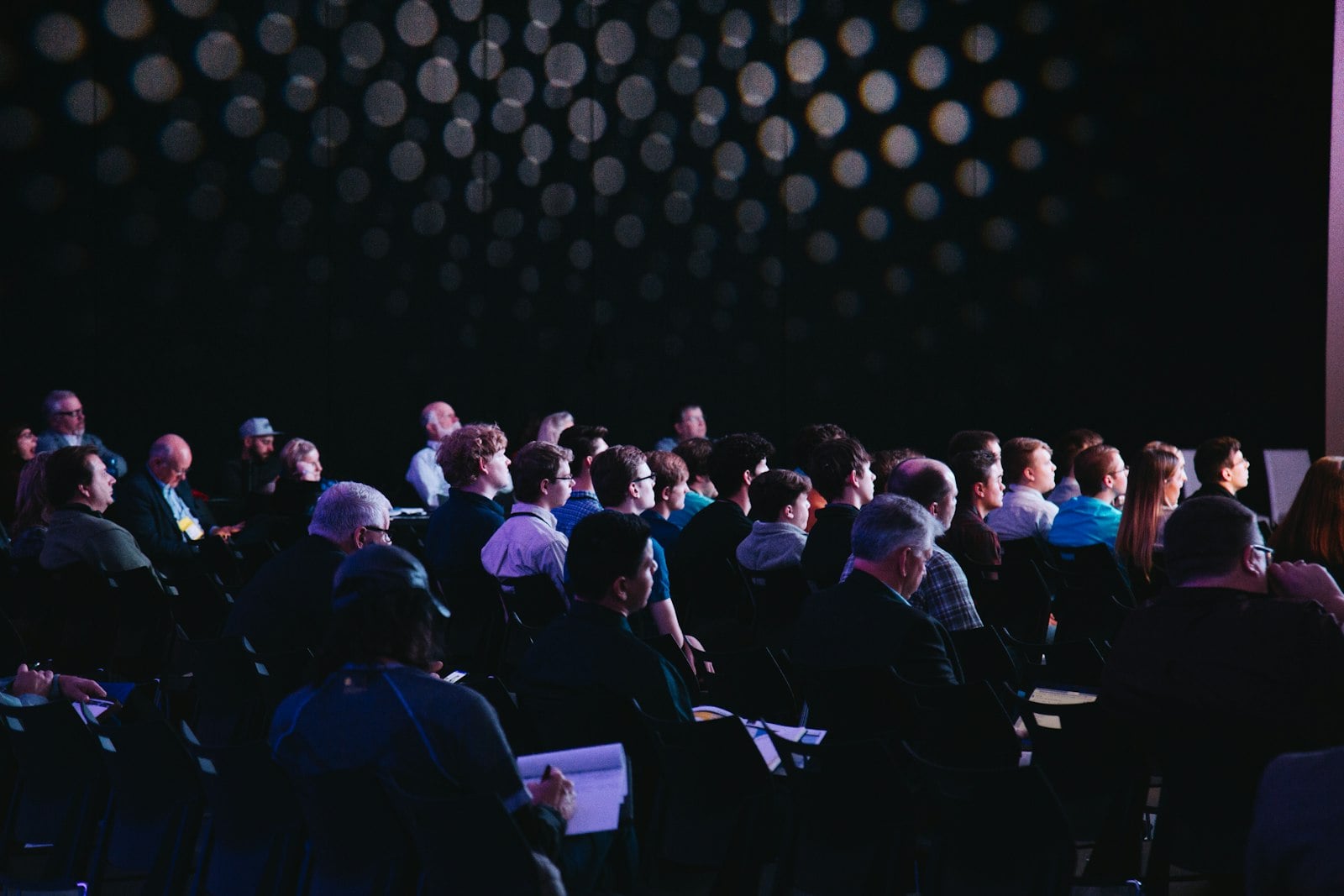 An enterprise leadership team gathered in a modern conference center